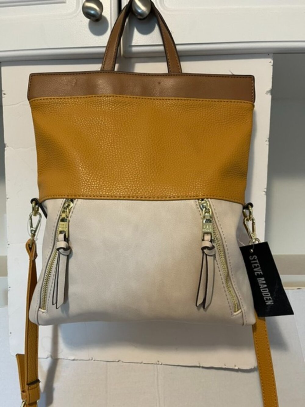 Steve Madden tricolor hobo bag.